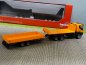 Preview: 1/87 Herpa Iveco Iveco Trakker 6×6 Abrollflat-LKW mit Tieflade-Anhänger 311595