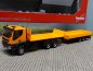 Preview: 1/87 Herpa Iveco Iveco Trakker 6×6 Abrollflat-LKW mit Tieflade-Anhänger 311595