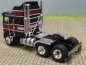 Preview: 1/87 Brekina Kenworth K 100 Aerodyne schwarz/dunkelrot 85726