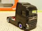 Preview: 1/87 Herpa Volvo FH schwarz 2-Achs Zugmaschine Felgen chromblau