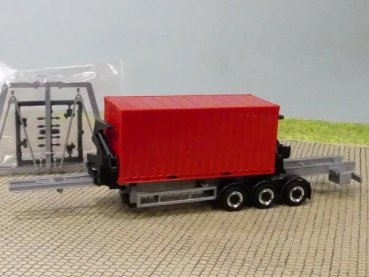 1/87 Herpa Seitenlader grau/schwarz Chromfelgen mit 20 ft Container rot