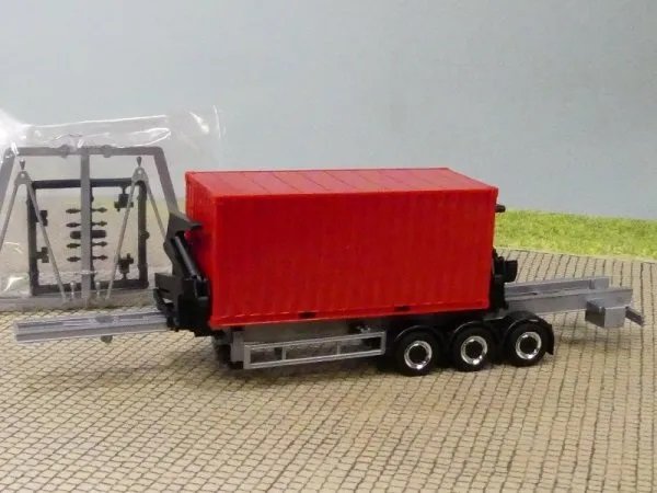 1/87 Herpa Seitenlader grau/schwarz Chromfelgen mit 20 ft Container rot