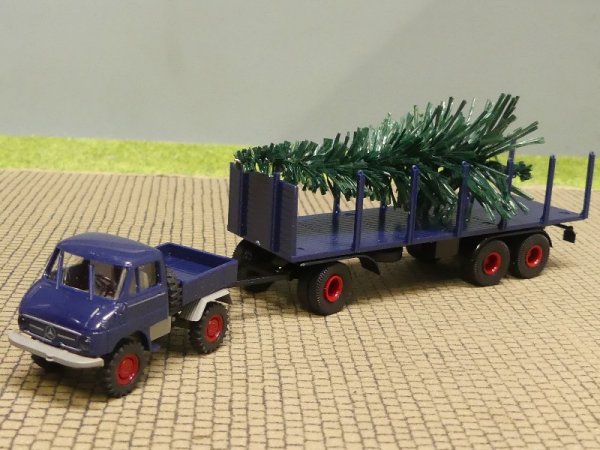 1/87 Brekina Unimog 411 dunkelblau mit Rumsanhänger + Baum 218702